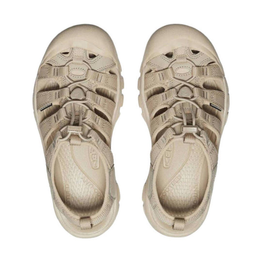 Pair of beige closed-toe hiking sandals with bungee laces and reinforced toe caps, top view