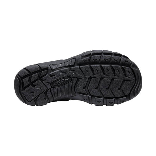 Black rugged rubber shoe outsole with deep traction lugs