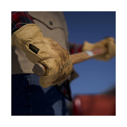 Tan leather work mitt gripping an axe handle