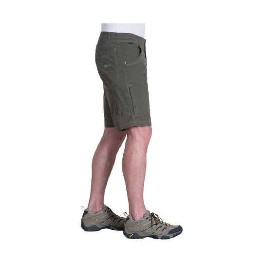 Dark olive men’s hiking shorts with side cargo pocket and contrast stitching, side view on a model