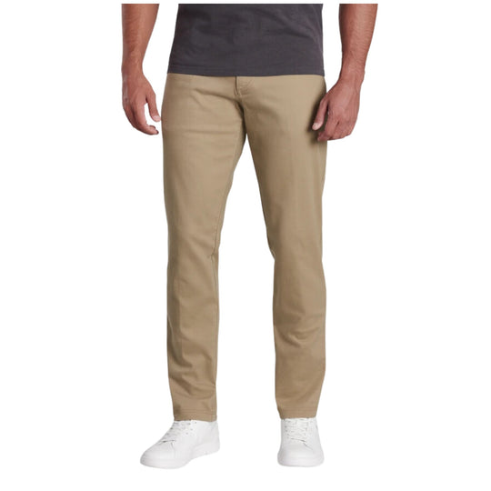 Khaki tapered pants shown on a model with a straight leg and white sneakers