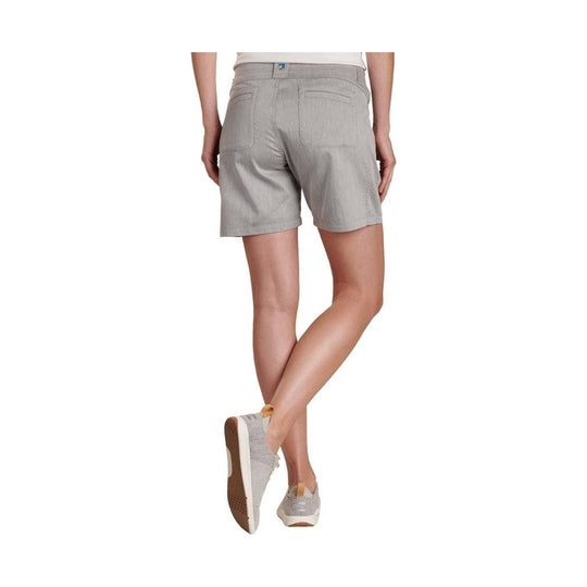 Gray knee-length shorts worn with light gray sneakers, shown from the back.