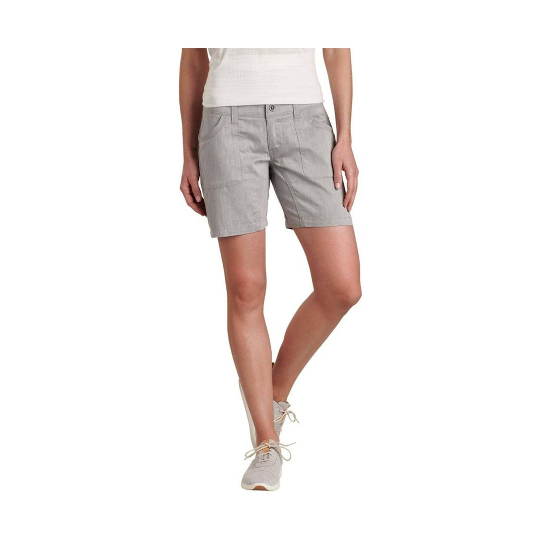 Light gray tailored shorts with front pockets and a button closure, shown with a white top and gray sneakers