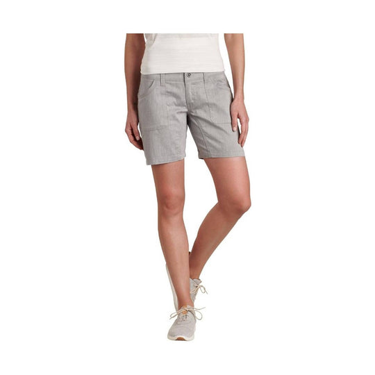 Light gray tailored shorts with front pockets and a button closure, shown with a white top and gray sneakers