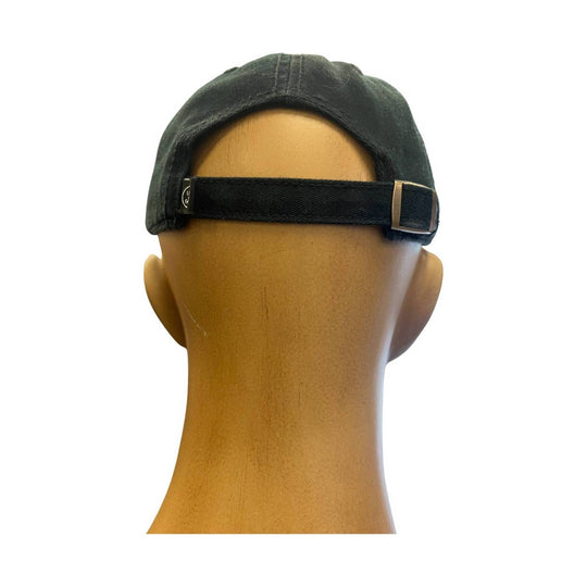 Black baseball cap shown from the back on a mannequin head with an adjustable strap and metal buckle
