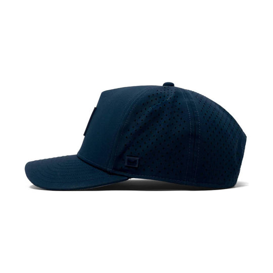 Navy perforated baseball cap with curved brim and side patch detail