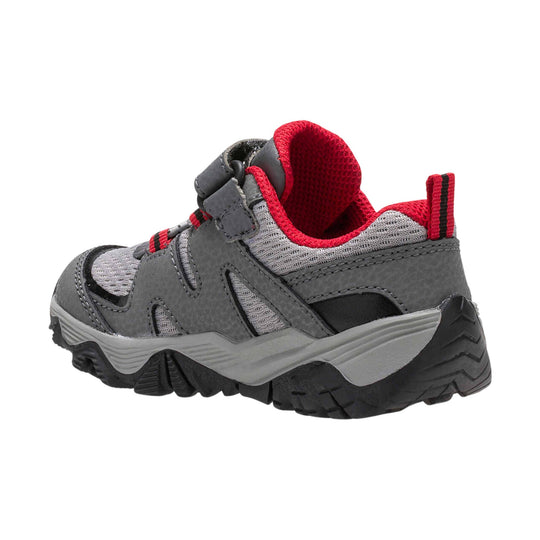 Gray and black kids' hiking sneaker with red trim, mesh panels, hook-and-loop strap, and rugged sole