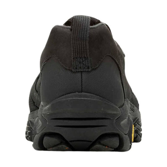 Black slip-on hiking shoe seen from the back with a pull tab and rugged lug sole