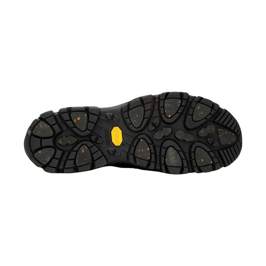 Black lugged shoe outsole with yellow Vibram label and orange speckling