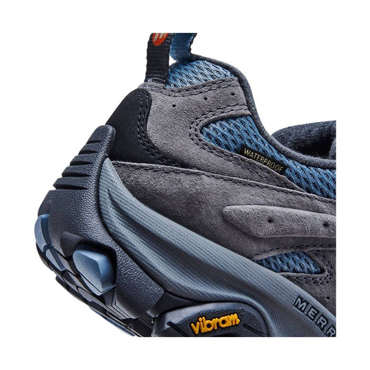Blue and gray hiking shoe with suede overlays, rugged sole, and pull tab