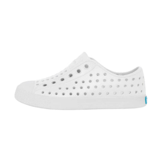 White perforated slip-on toddler shoe with a thick sole and small blue heel tab