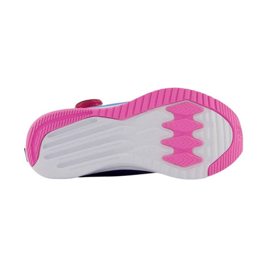 Pink and white sneaker outsole with ribbed tread and BOA dial visible at the side.