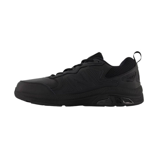 Black low-top athletic work shoe with mesh collar and thick treaded sole, shown in side profile