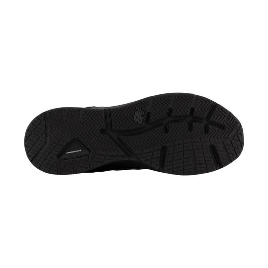 Black shoe outsole with textured tread pattern and visible New Balance logo, shown from below