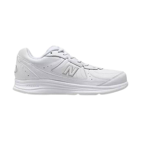 White low-top athletic sneaker with laces, side logo, and thick cushioned sole
