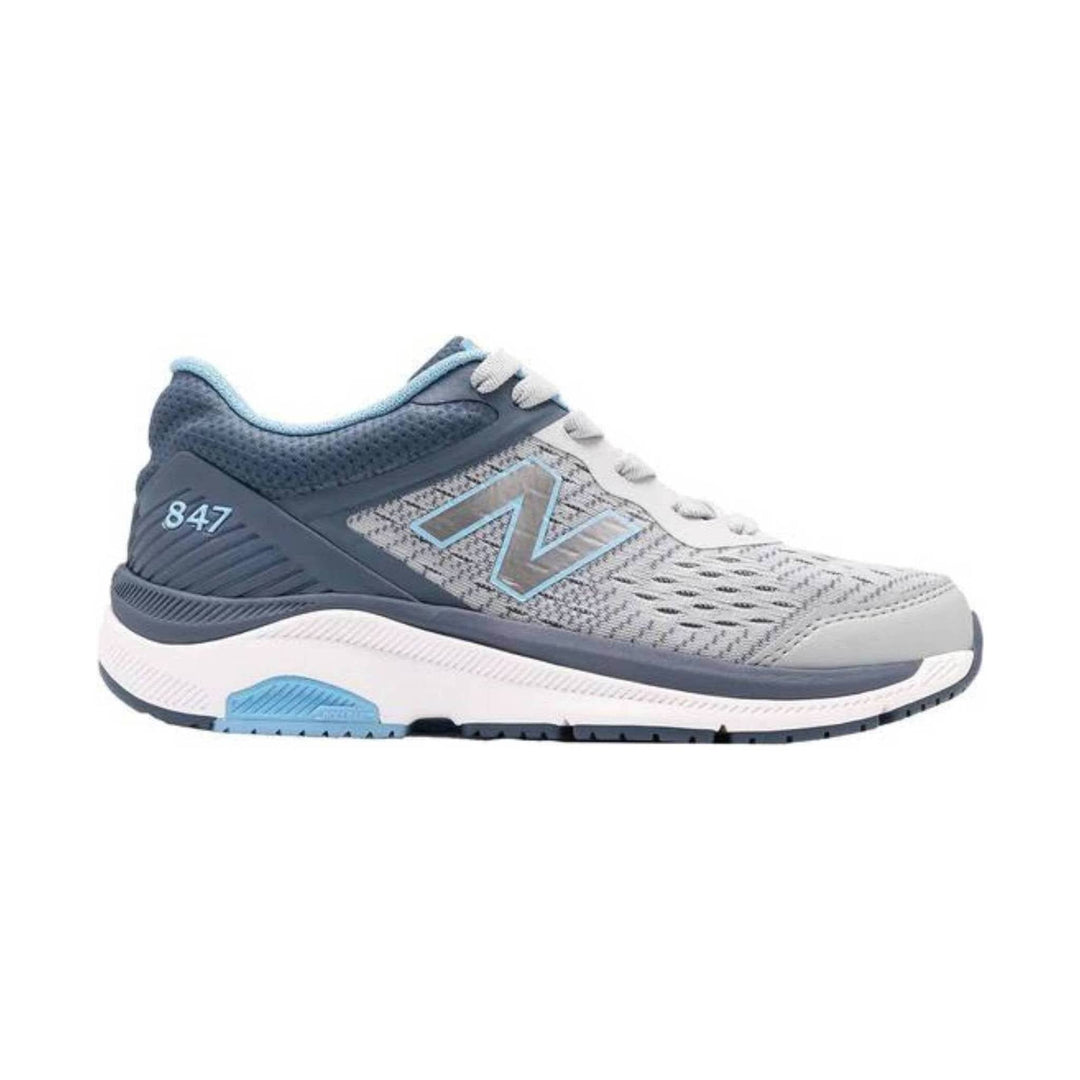 Gray and blue athletic walking shoe with white laces and a cushioned sole, shown in side profile