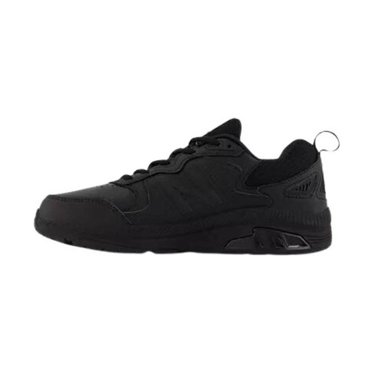 Black low-top athletic work shoe with lace-up closure and chunky sole, side view