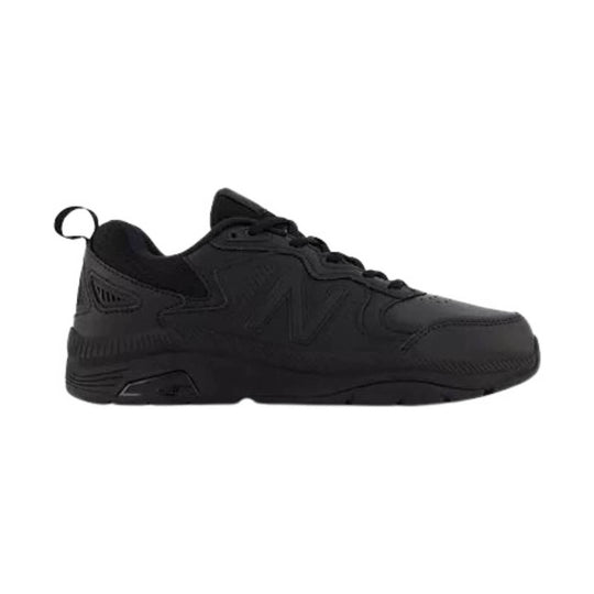 Black athletic slip-resistant sneaker in side view with laces and a pull tab at the heel