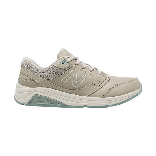 Beige lace-up walking shoe with mesh panels and cushioned sole