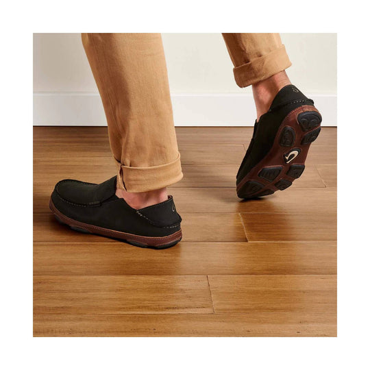 Black slip-on loafers with brown outsoles, shown from the side and sole