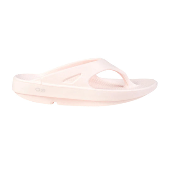 Light pink cushioned slide sandal with a wide toe strap and contoured sole, shown in side view