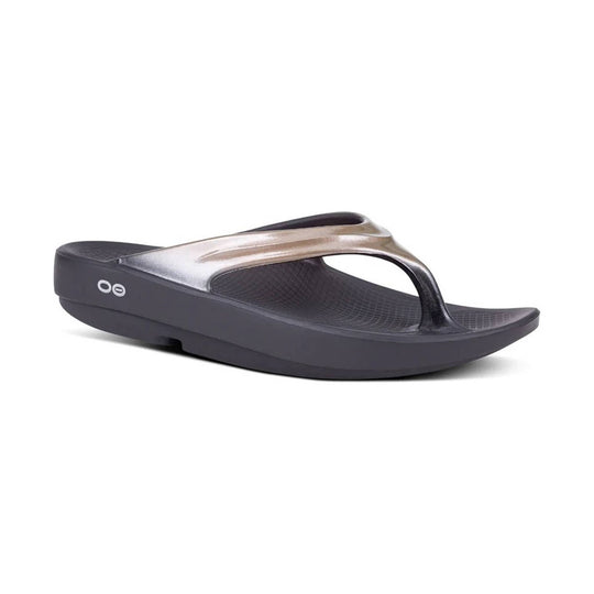 Black and metallic thong sandal with a thick platform sole and textured footbed