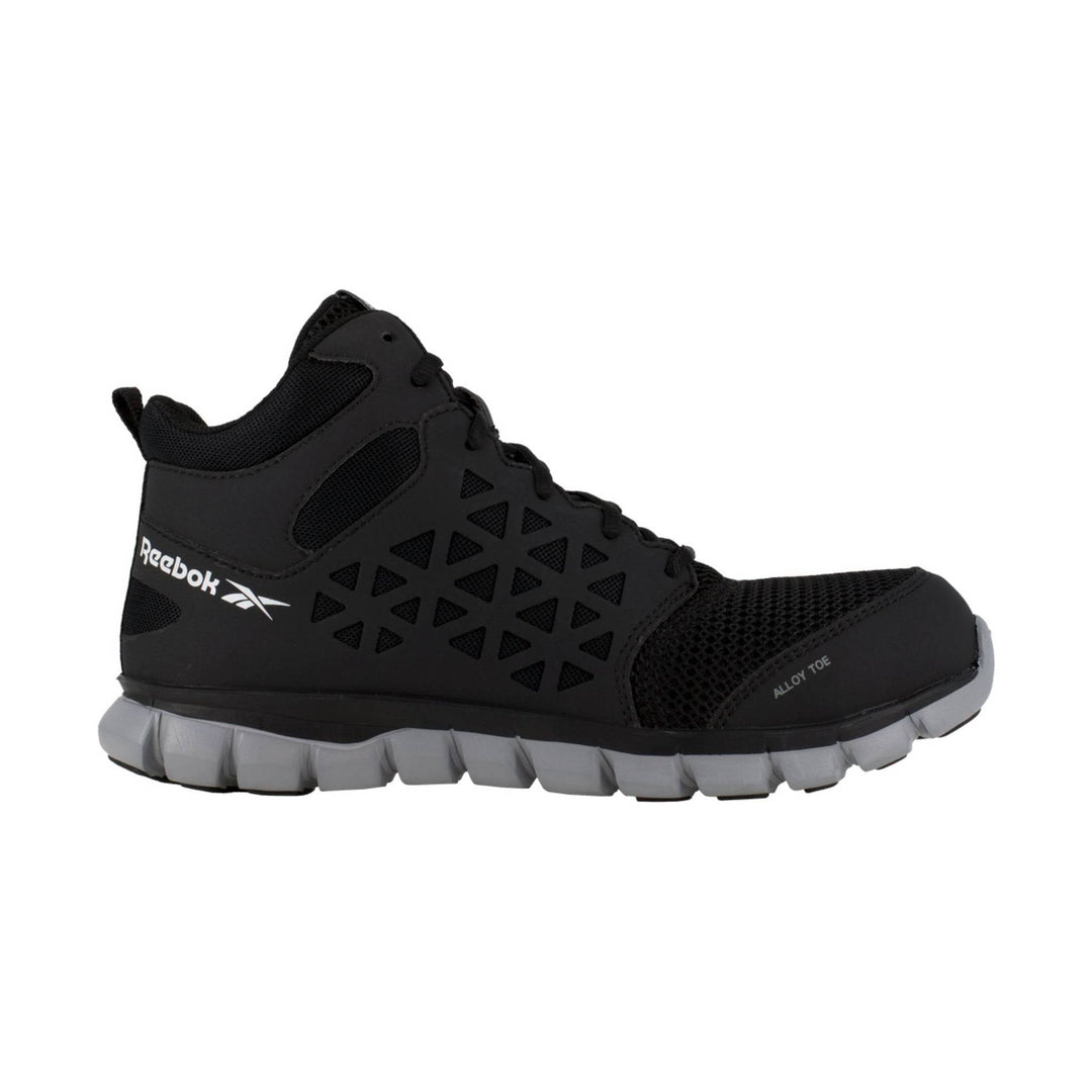 Black mid-top work shoe with mesh panels, triangular cutouts, and a gray segmented sole