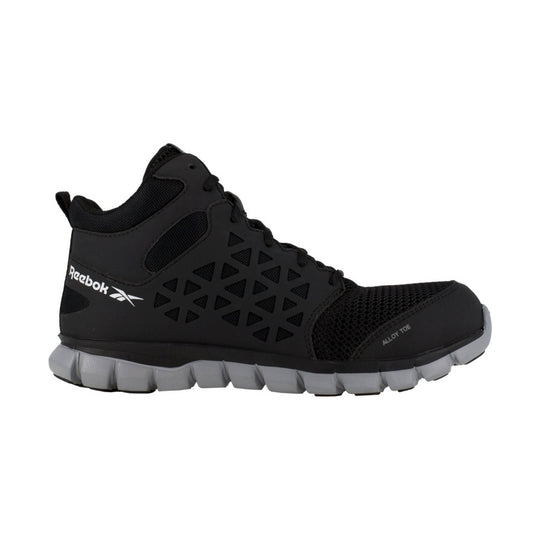 Black mid-top work shoe with mesh panels, triangular cutouts, and a gray segmented sole