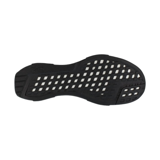 Black shoe outsole with white traction inserts and oil and slip resisting markings