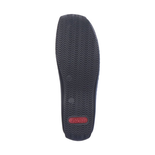 Black rubber shoe outsole with wavy tread and a red rieger logo label