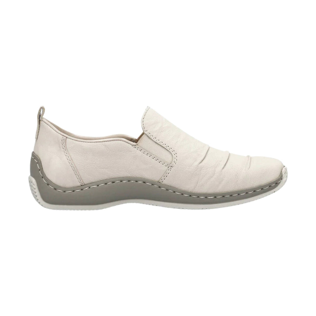 Cream leather slip-on shoe with stitched gray sole, side profile