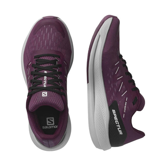 Purple running shoes with black laces, white midsoles, and Salomon branding, shown in top and side views