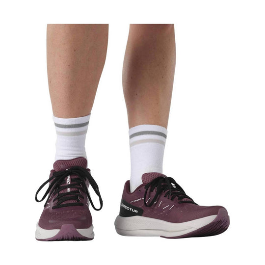 Maroon running shoes with black laces, white midsoles, and white crew socks, shown from front and side