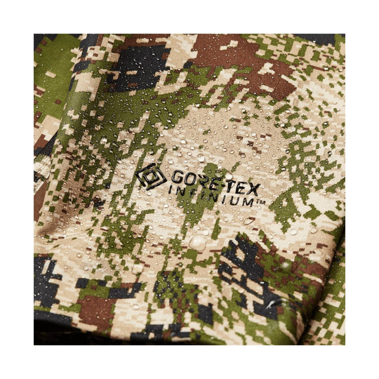 Camouflage jacket fabric with GORE-TEX INFINIUM logo and water droplets