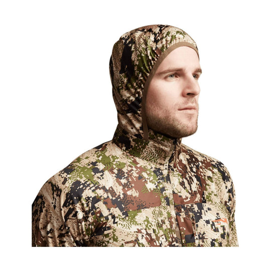 Camouflage hooded jacket with front zipper, shown on a male model in profile