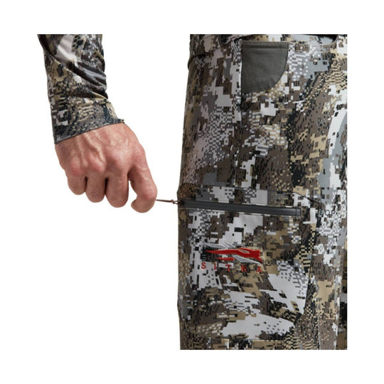 Camouflage athletic pants with zippered thigh pocket and SITKA logo