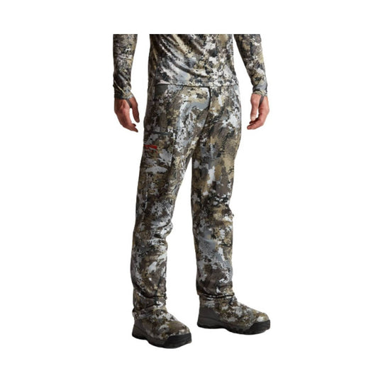 Camouflage long-sleeve base layer pants and boots, shown from the back