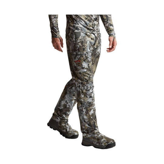 Camouflage pants with matching boots on a model
