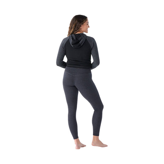 Dark charcoal women’s leggings shown on a model from the back