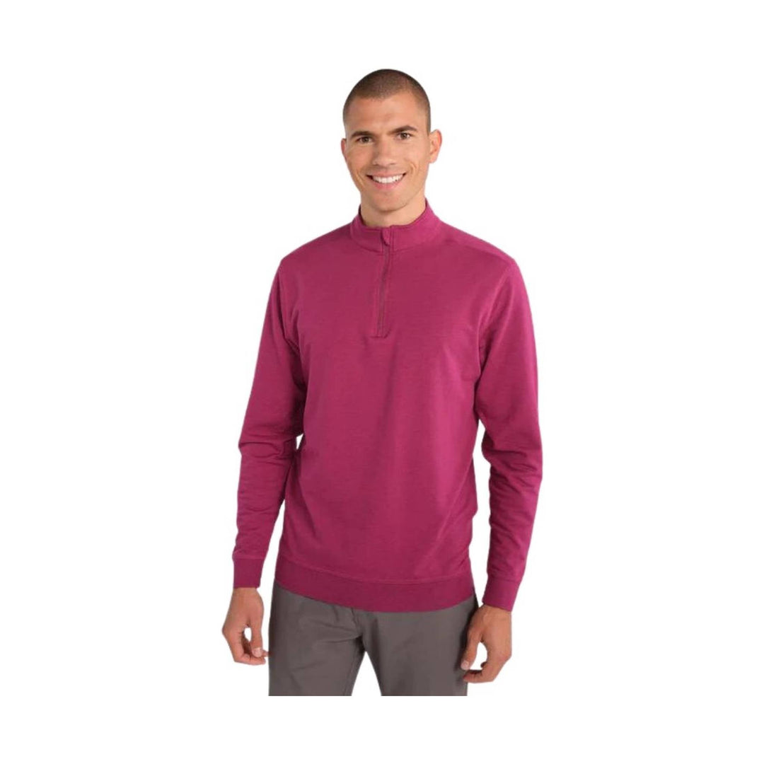 Magenta long-sleeve quarter-zip pullover with a mock neck and ribbed cuffs