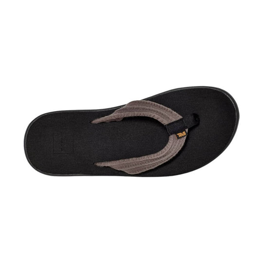 Black thong sandal with woven taupe straps and a visible Teva tag