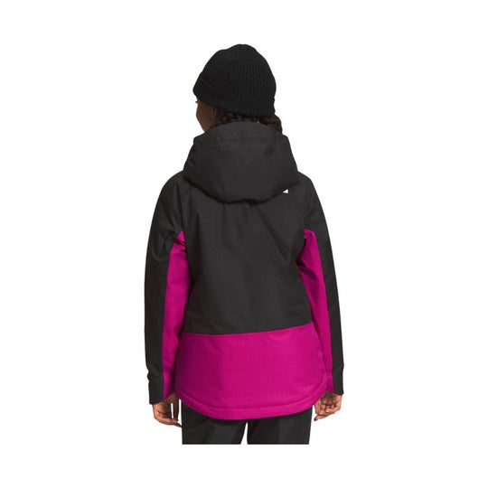 Kids insulated hooded jacket with black upper section and bright pink lower and sleeve panels, shown from the back