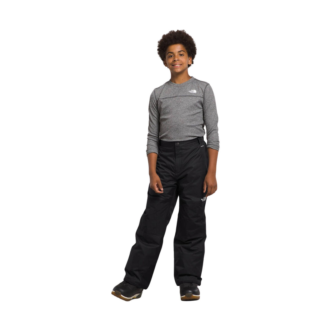 Black insulated snow pants with an elastic waist and a small white logo on the leg