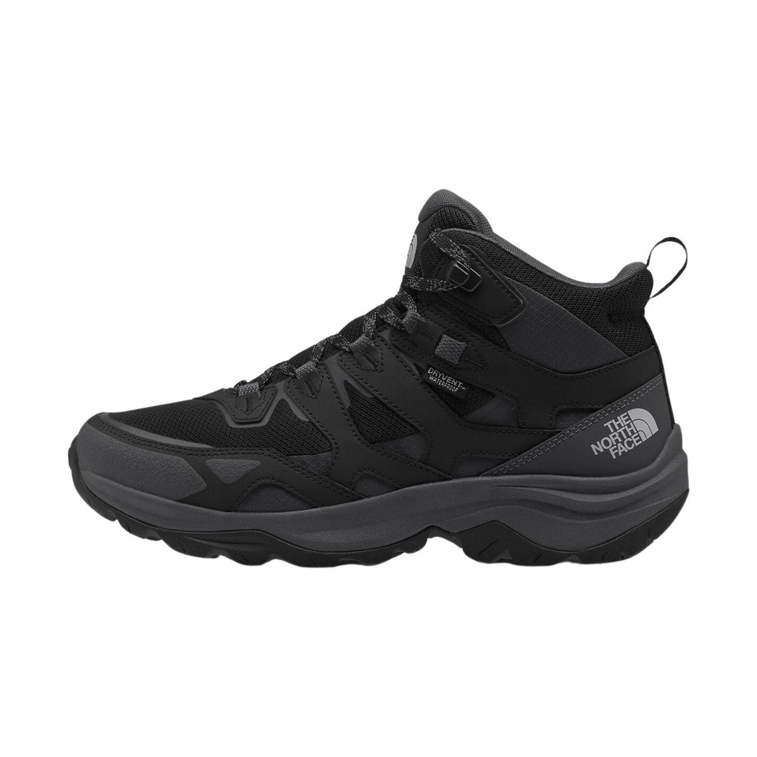 Black mid-top hiking boot with mesh panels, rugged tread, and visible The North Face logo