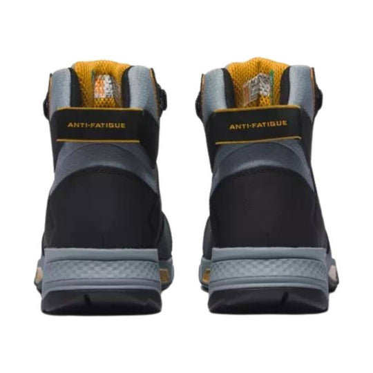 Black and gray work boot with yellow lining and an anti-fatigue strap on the heel