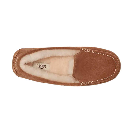 Tan suede slipper with cream fleece lining and UGG logo on the insole, shown from above