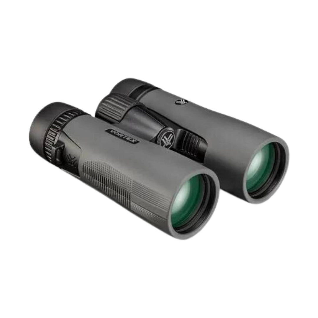 Black binoculars with green-tinted lenses and textured grip