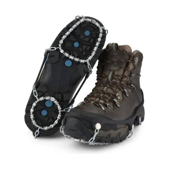 Pair of brown winter boots with traction cleats attached to the soles